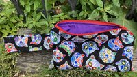 Handmade zippered wristlet bag (Clutch) Large by Lucky Burrito featuring cat skeletons on black fabric