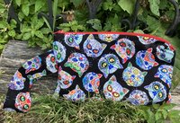 Handmade zippered wristlet bag (Clutch) Large by Lucky Burrito featuring cat skeletons on black fabric