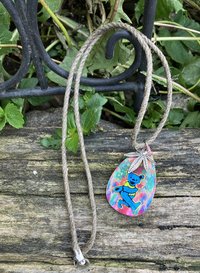 Tear drop necklace with blue dancing bear and cannabis leaf charm