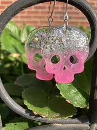 Resin pink with sparkles skull earrings