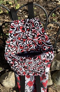Handmade coffin bag by Lucky Burrito with crow, skeleton, and red roses design 