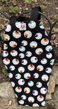 Handmade coffin bag by Lucky Burrito with Glow in the dark eyeballs