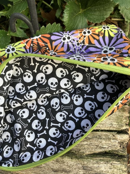Handmade zippered wristlet bag (Clutch) Large by Lucky Burrito featuring flower skulls fabric