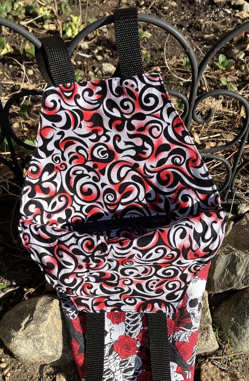Handmade coffin bag by Lucky Burrito with crow, skeleton, and red roses design 