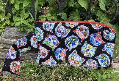 Handmade zippered wristlet bag (Clutch) Large by Lucky Burrito featuring cat skeletons on black fabric