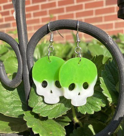 Resin lime green skull earrings