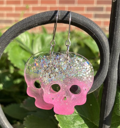 Resin pink with sparkles skull earrings