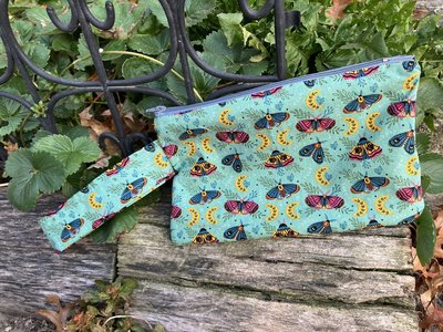 Handmade zippered wristlet bag (Clutch) Large by Lucky Burrito featuring Moth and Moons