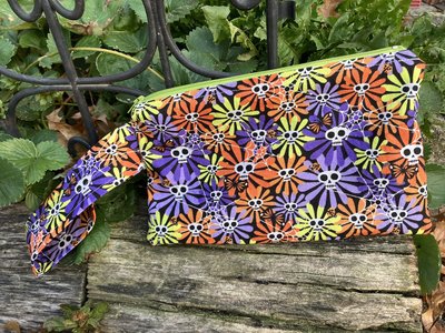Handmade zippered wristlet bag (Clutch) Large by Lucky Burrito featuring flower skulls fabric