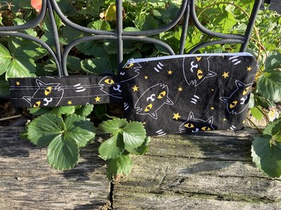 Handmade by Lucky Burrito featuring black cosmic cats, zippered wristlet bags (clutch)