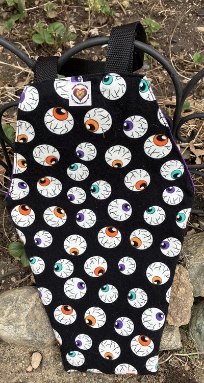 Handmade coffin bag by Lucky Burrito with Glow in the dark eyeballs