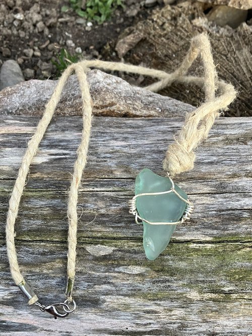 River Glass Necklace  blue river glass on silver wire wrapped 24 in   Hemp cord