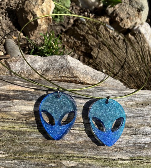 Alien resin pendant on green cable choker