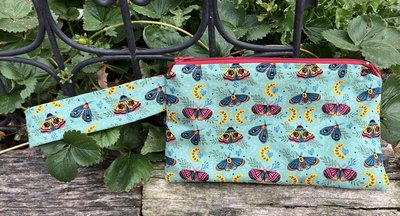 Handmade zippered wristlet bag (Clutch) Large by Lucky Burrito featuring Moths and moons